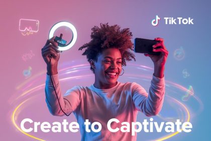 A joyful creator filming with a smartphone and ring light surrounded by glowing TikTok colors, symbolizing how short-form videos drive engagement and brand awareness.