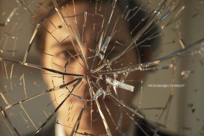 A glowing brand logo emerging from shattered glass, symbolizing reputation recovery, renewed trust, and brand transformation.