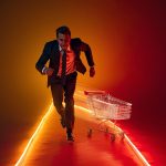 A marketer holding a glowing digital magnet pulling back shopping carts and customer icons, symbolizing recovery from abandoned carts through retargeting and automation.