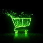 A hand holds a small glowing Earth sprouting digital leaves, symbolizing the connection between profitability and sustainability in modern marketing.