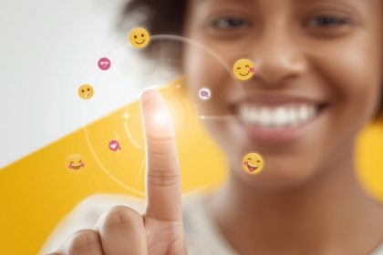 A smiling marketer surrounded by bright emojis, hearts, and shopping icons, symbolizing how humor and fun drive engagement in digital marketing.