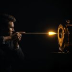 A glowing map pin aligned with a clock surrounded by engagement icons, symbolizing how perfect timing and location drive marketing success.