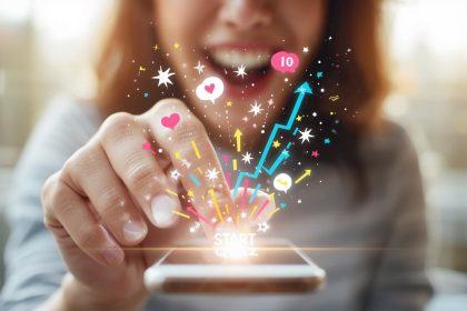 A marketer smiles as glowing quiz elements and question icons float around a laptop, symbolizing how interactive quizzes engage and convert users in digital marketing.