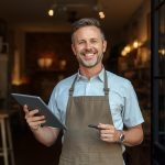 A small business connecting physical and digital worlds through hybrid marketing, symbolizing the integration of online engagement and offline growth.