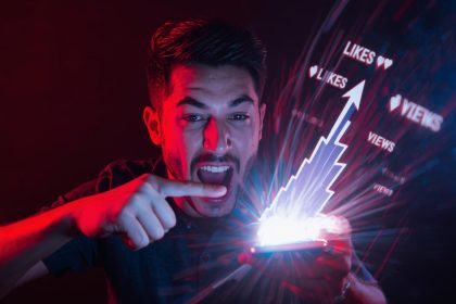 A digital creator pointing at a glowing smartphone screen showing viral engagement numbers, symbolizing the power of short-form video to drive attention and conversions.