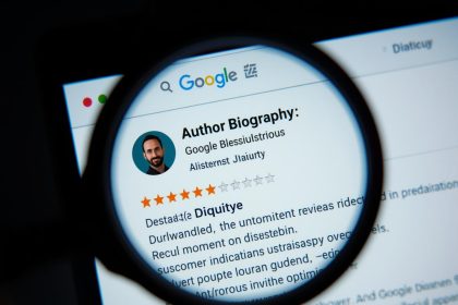 A marketer reviewing a holographic checklist of Google’s E-E-A-T factors — Expertise, Experience, Authoritativeness, and Trust — symbolizing content credibility in 2025.