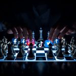 A marketer strategically moves chess pieces shaped like social media icons on a glowing digital chessboard, representing data-driven decision-making in 2025.