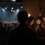 Split-screen showing a micro influencer engaging closely with followers and a macro influencer addressing a large crowd, symbolizing the balance between trust and reach in influencer marketing.