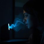 A person speaking to a voice assistant while data streams visually from their voice, representing privacy and trust concerns in AI-powered voice interactions.