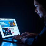 Modern marketer analyzing stylish email newsletter designs on a laptop, symbolizing engaging and trend-forward templates for 2025.