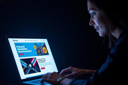 Modern marketer analyzing stylish email newsletter designs on a laptop, symbolizing engaging and trend-forward templates for 2025.