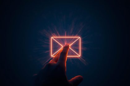 Marketer celebrating as email open rates and click-through rates rise on a glowing analytics dashboard.