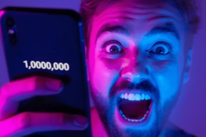 Content creator holding a glowing smartphone showing viral TikTok posts with millions of likes, representing 2025 TikTok marketing ideas for going viral.