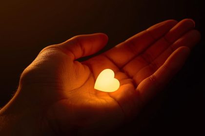 A professional removing a mask to reveal their real face, symbolizing authenticity and trust in purpose-driven branding.