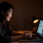 A business owner warmly replying to an online customer review, symbolizing engagement and trust-building through authentic responses.