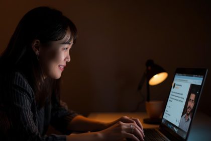 A business owner warmly replying to an online customer review, symbolizing engagement and trust-building through authentic responses.