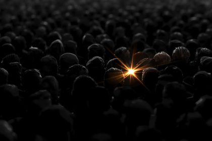 A single glowing brand emerging from a crowd of faded competitors, symbolizing effective brand positioning and inspiration for 2025 success.