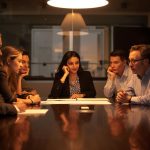 Team of business professionals analyzing high-intent SEO data for B2B growth in 2025.