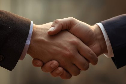 Handshake between journalist and marketer over story outline