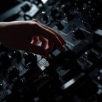 Person analyzing A/B test results on screen with urgency