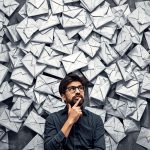 Person analyzing email engagement metrics on screen