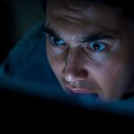 Person reacting to system outage email alert