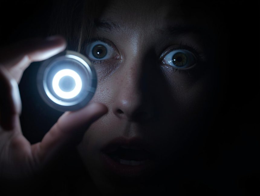 Person pressing trigger button with surprise, visualizing automatio