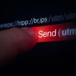 Person clicking email link with hidden URL tracking trail
