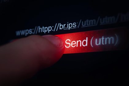 Person clicking email link with hidden URL tracking trail