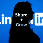 Employee sharing brand message through a LinkedIn megaphone, symbolizing advocacy.