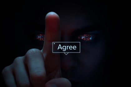 A focused marketer hesitates before clicking a glowing “Agree” button on a digital consent screen, symbolizing the ethics and emotions of data use in AI-driven marketing.