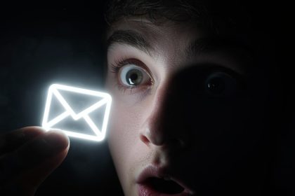 A surprised creator pointing at rising analytics charts on a bright screen, expressing excitement about Influencer-Affiliate Hybrids.