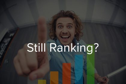 Focused marketer pointing at evergreen SEO content blocks on a screen, showing confidence and clarity about long-term rankings.