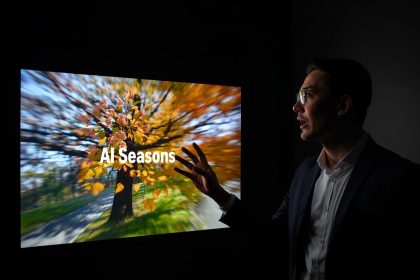 A focused digital marketer analyzing AI-powered seasonal branding visuals on a screen, showing curiosity and strategic insight.