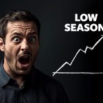 Affiliate marketer confidently reviewing analytics dashboard during low season, discovering hidden revenue opportunities through optimized strategy.